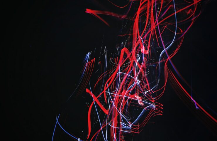 red and blue doodle artwork with black background